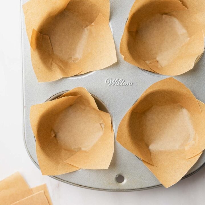DIY parchment paper muffin liners in muffin tin.