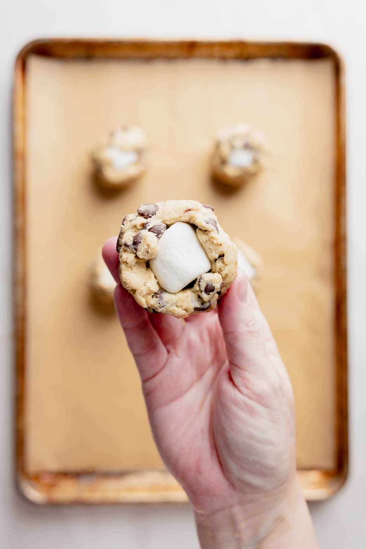 Cookie dough wrapped around frozen marshmallow.