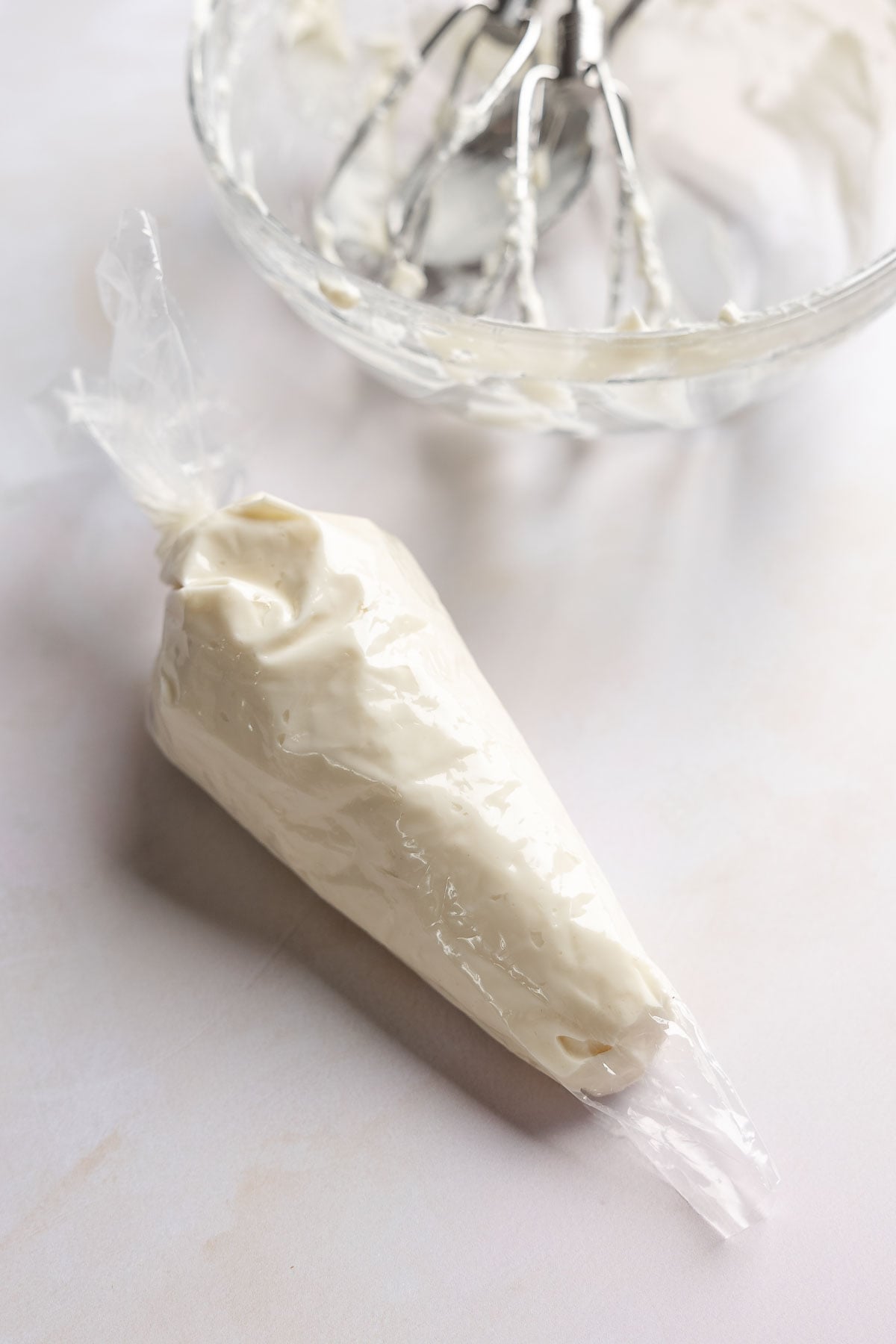 Cream cheese filling in piping bag.