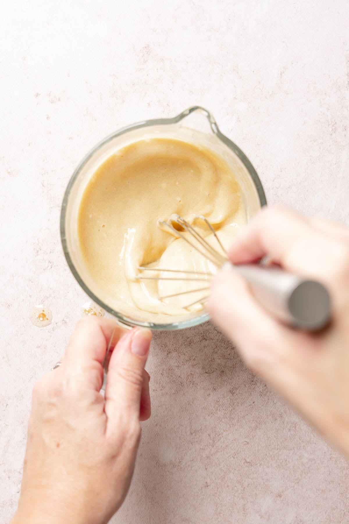 Wet ingredients whisked together in measuring cup.
