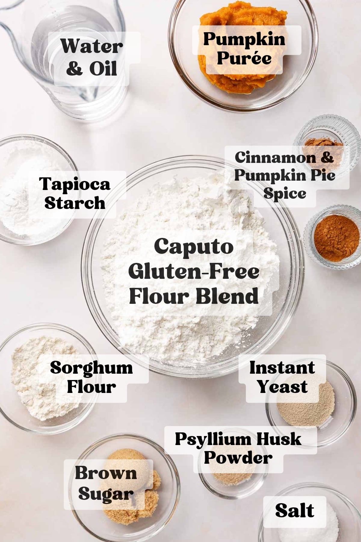Ingredients for gluten free pumpkin bagels measured out in bowls.